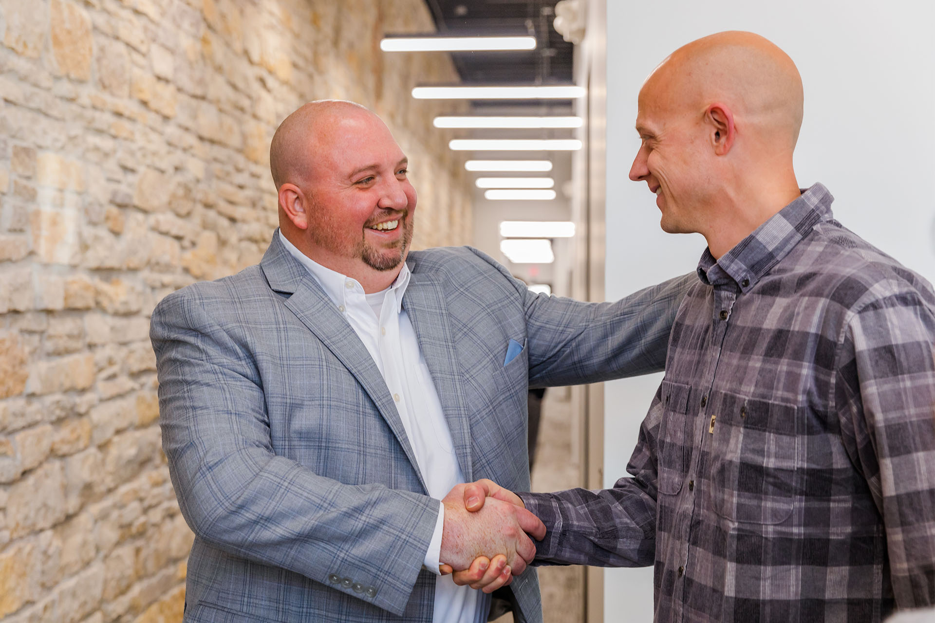 Handshake between two men is mortgage loan closing agreement.